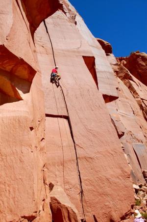 The Author climbing Jolly Rancher 5.10, Pistol Whipped Wall, Indian Creek, Utah